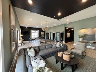 a large living room with couches and a table