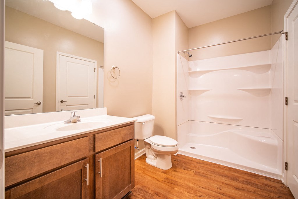 A bathroom with a toilet, sink, and bathtub.