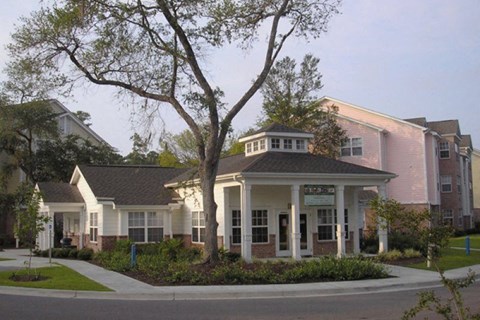 a house with a tree in the front of it