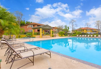 Swimming Pool with Lounge Chairs Swimming Pool with Lounge Chairs, at Sunbow Villas, Chula Vista, CA - Photo Gallery 5