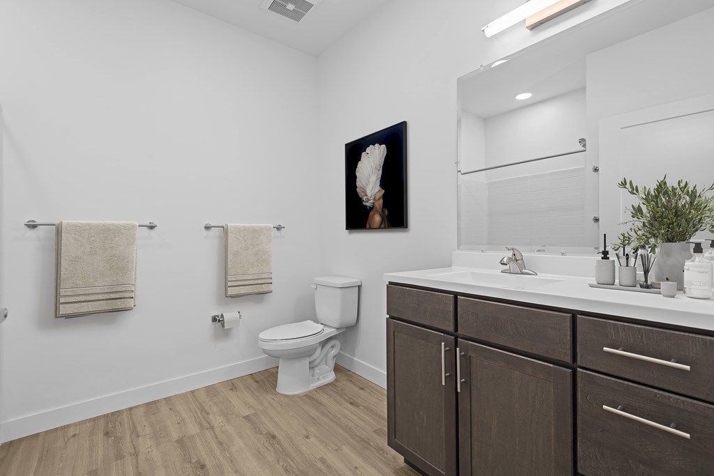 Bathroom with a toilet and sink at 36N Apartments, Tulsa, OK, 74106