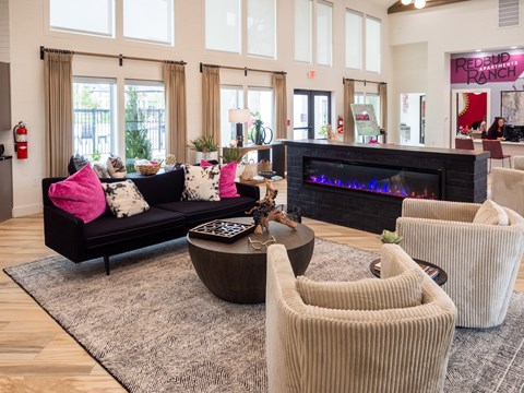 A living room with a fireplace and a couch.