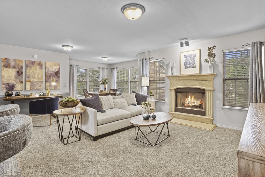 A living room with a fireplace and a couch.