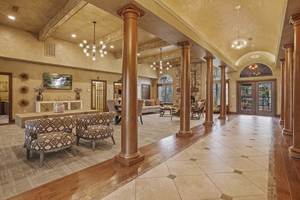 A large room with a long hallway and a fireplace.