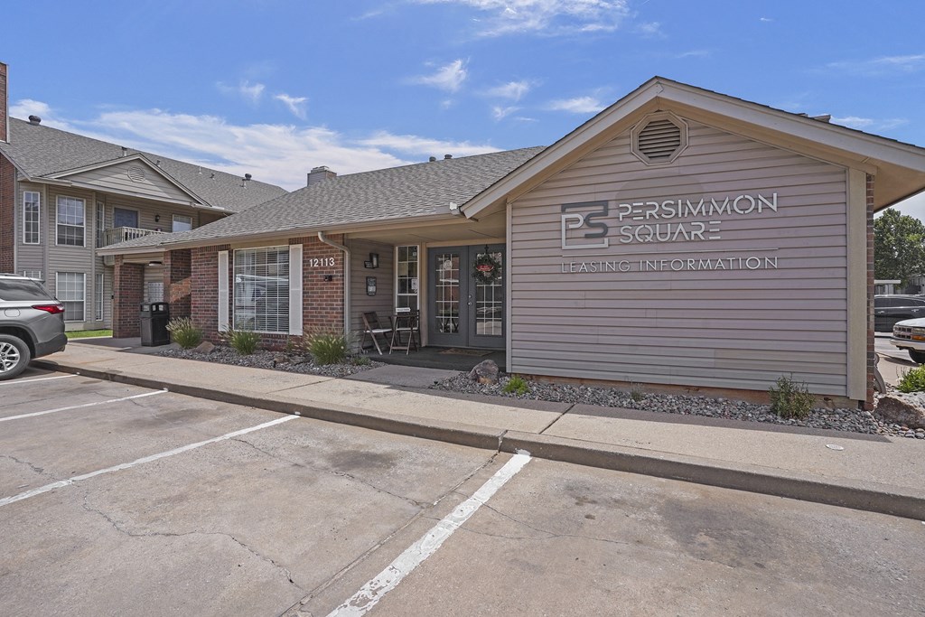 A building with the sign Persimmon Square in front of it.
