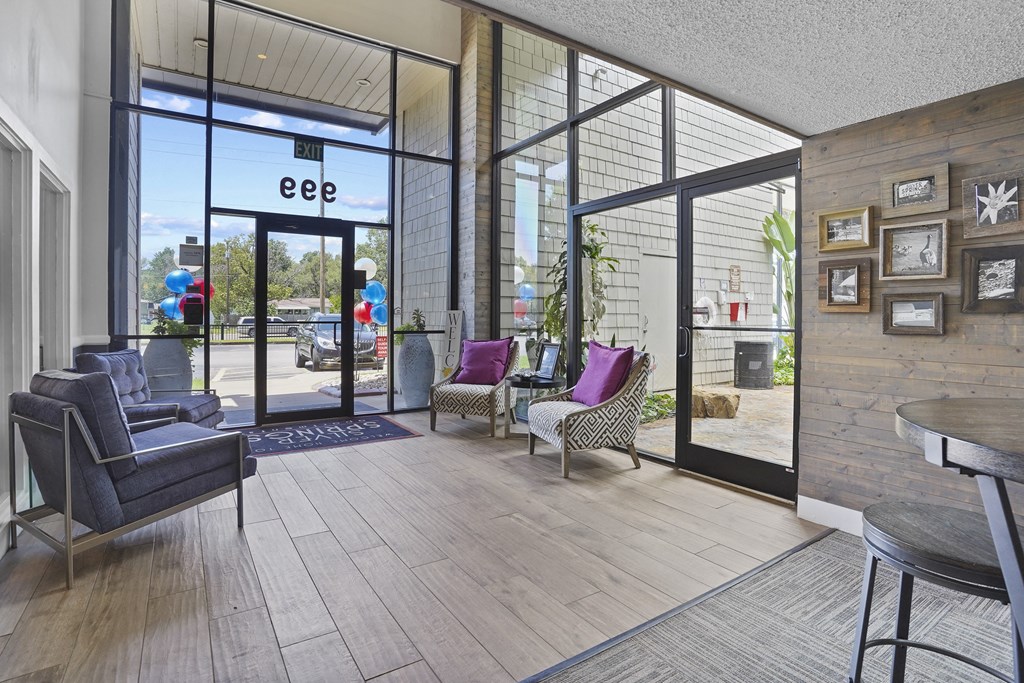 A room with a glass door that has the letters "eee" on it.