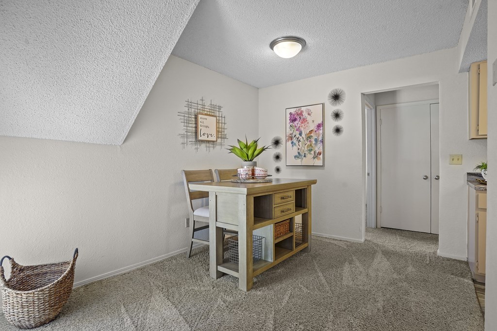 A room with a desk and chair in it.