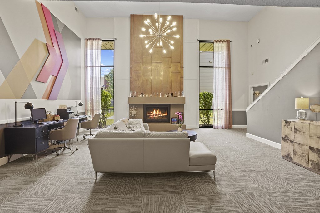 A modern living room with a fireplace and a couch.