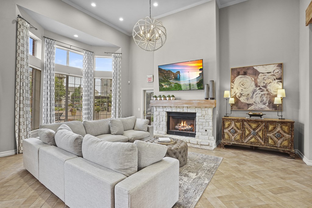 A living room with a fireplace and a large couch.