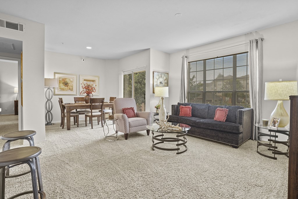 A living room with a grey sofa and a coffee table.