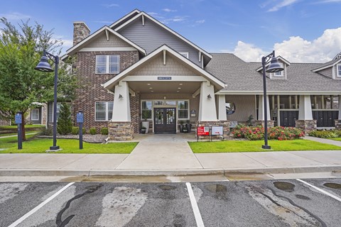 A building with a grey roof and a white entrance.