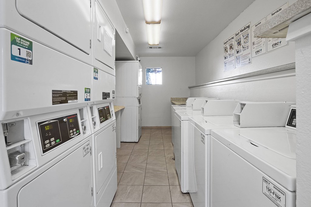 A row of washing machines in a laundromat.