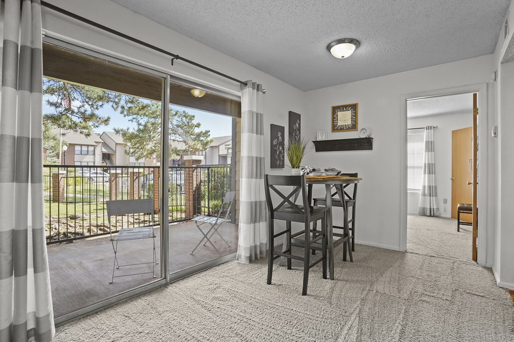 A dining room with a table and chairs is shown.
