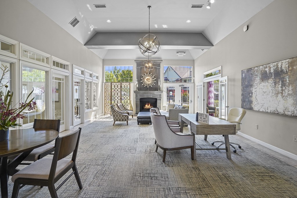 A large, well-lit room with a dining table and chairs.