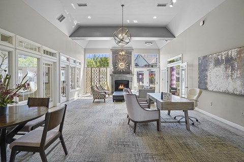A large, well-lit room with a dining table and chairs.