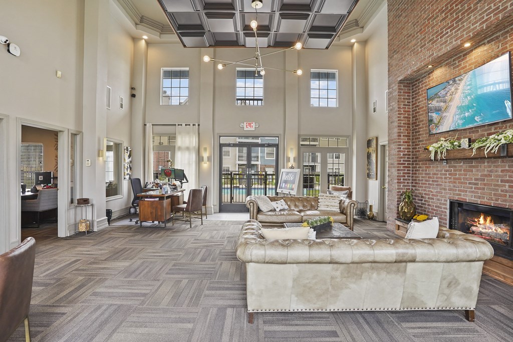 A large room with a fireplace and a couch.