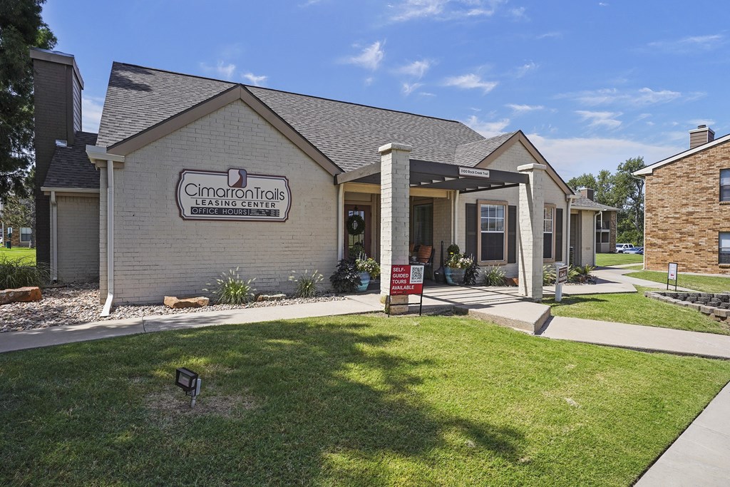 A building with a sign that says Cimarron Trails Hearing Centers.