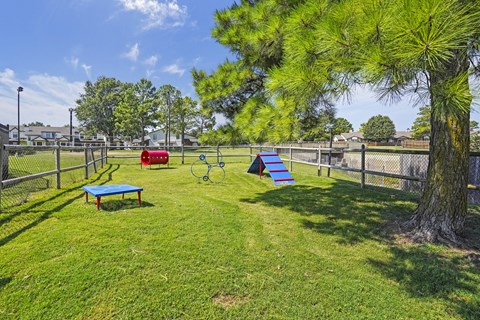 A playground with a blue table and a slide.