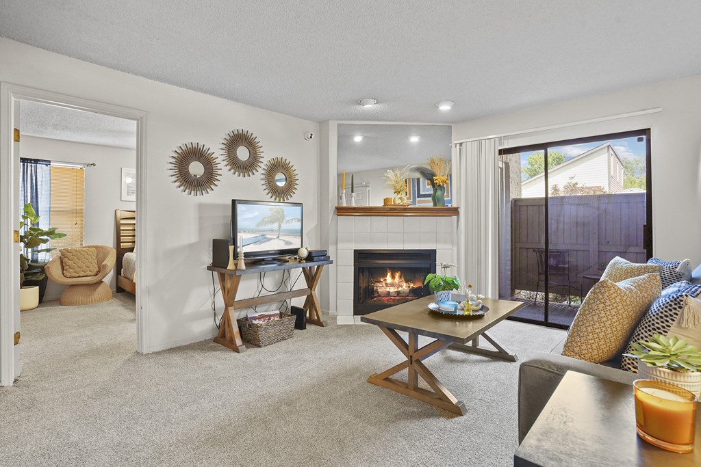 A living room with a fireplace and a couch.