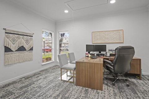 A room with a desk and a chair.