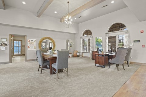 A conference room with a long table and chairs.