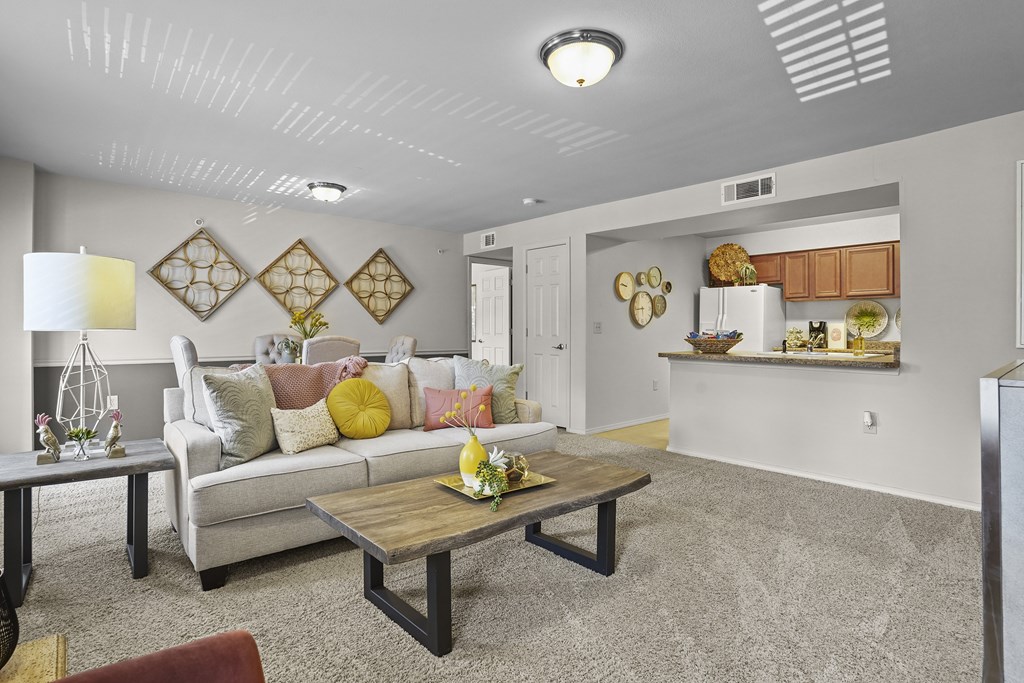 A living room with a grey couch and a coffee table.