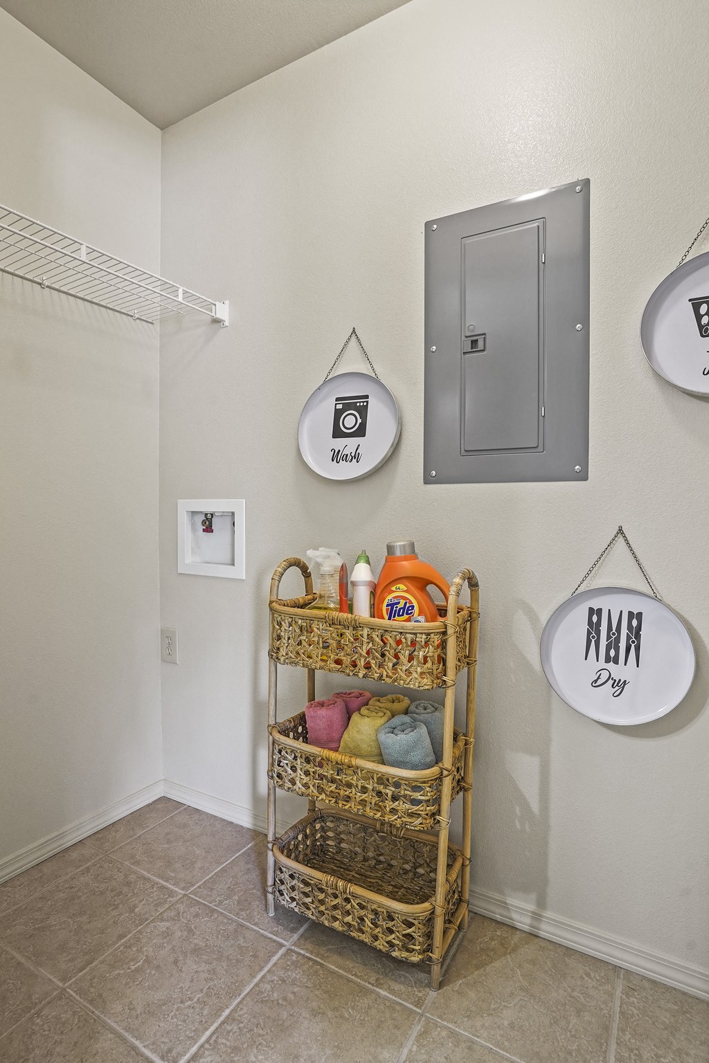 A hallway with a basket on a shelf and a sign that says "Mrs. DIY".