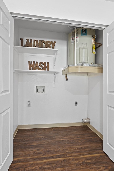 Laundry and wash sign on a wall in a room.