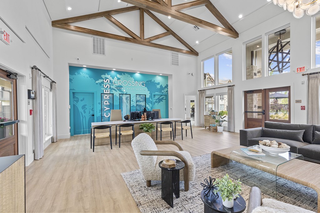 A modern living room with a glass table and a sofa.