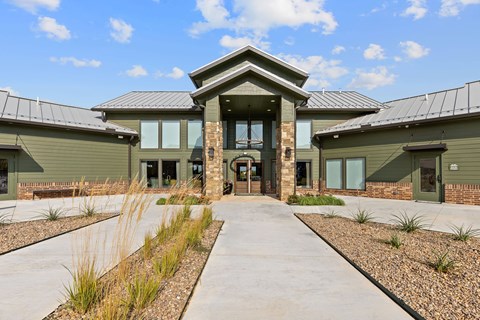 A modern building with a central entrance and a symmetrical design.
