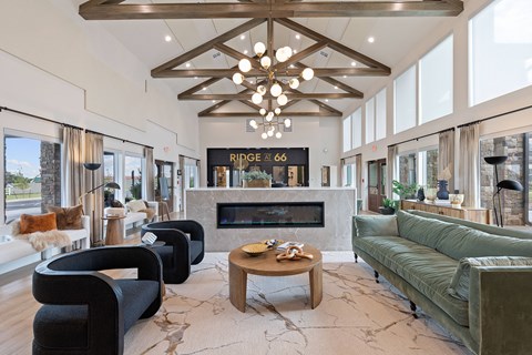 A living room with a fireplace and a chandelier.