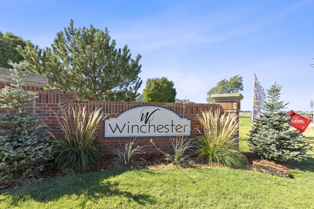 A sign that says Winchester is in front of a building.