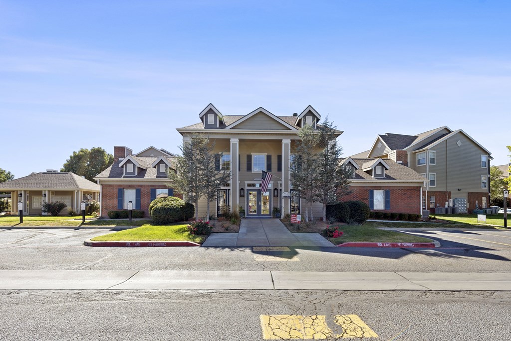 A row of houses with a large one in the front.