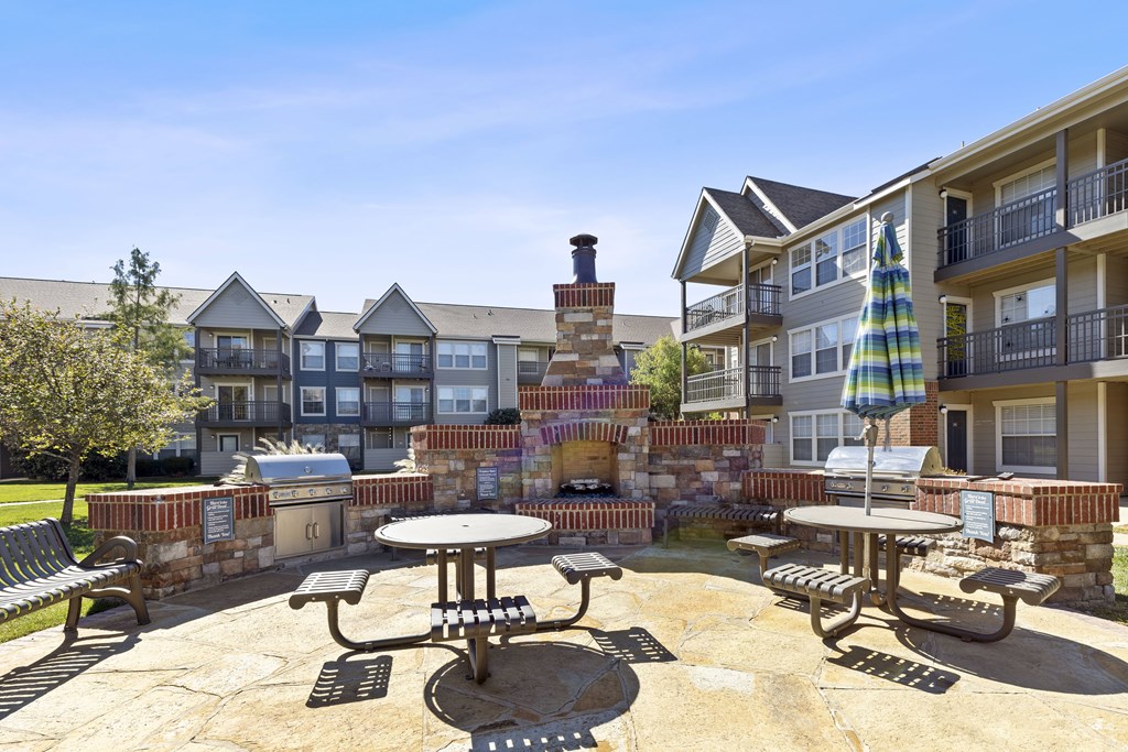 A sunny day at the outdoor seating area of a residential complex.