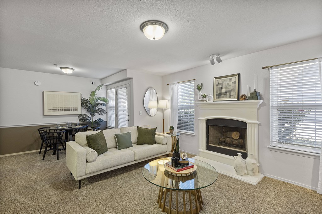 A living room with a fireplace and a couch.