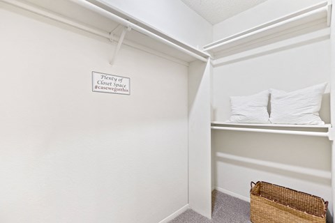A sign on a wall that says plenty of closet space.