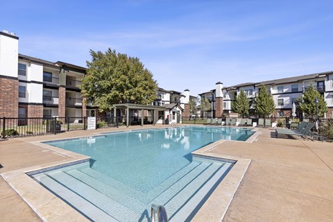 A large swimming pool in a residential area.