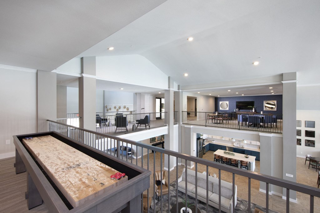 a view of a living room with a bar and a dining room