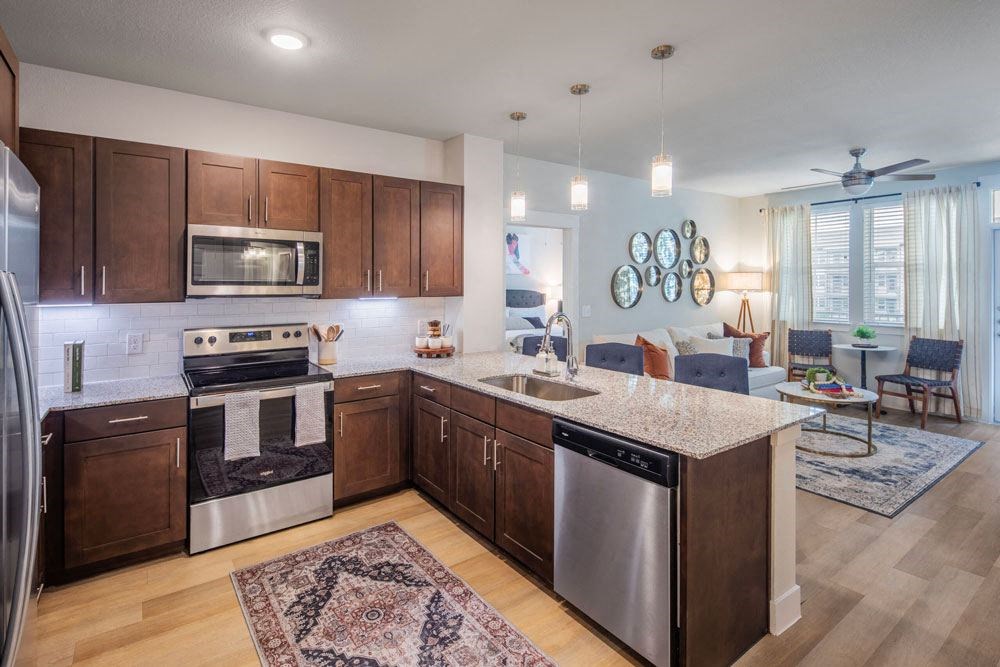 a kitchen and living room with a counter top