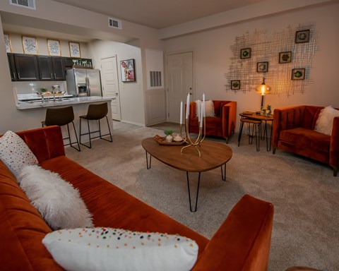 A living room with a brown couch and a coffee table.