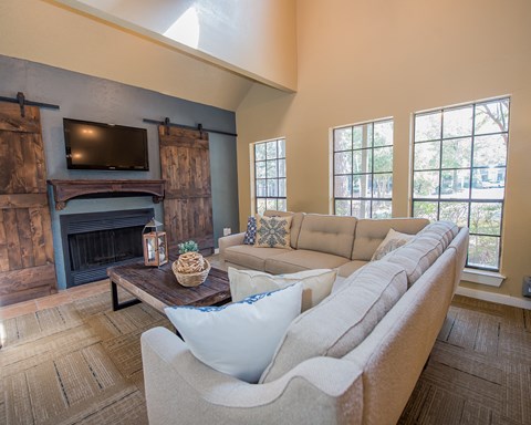 A living room with a fireplace and a couch.