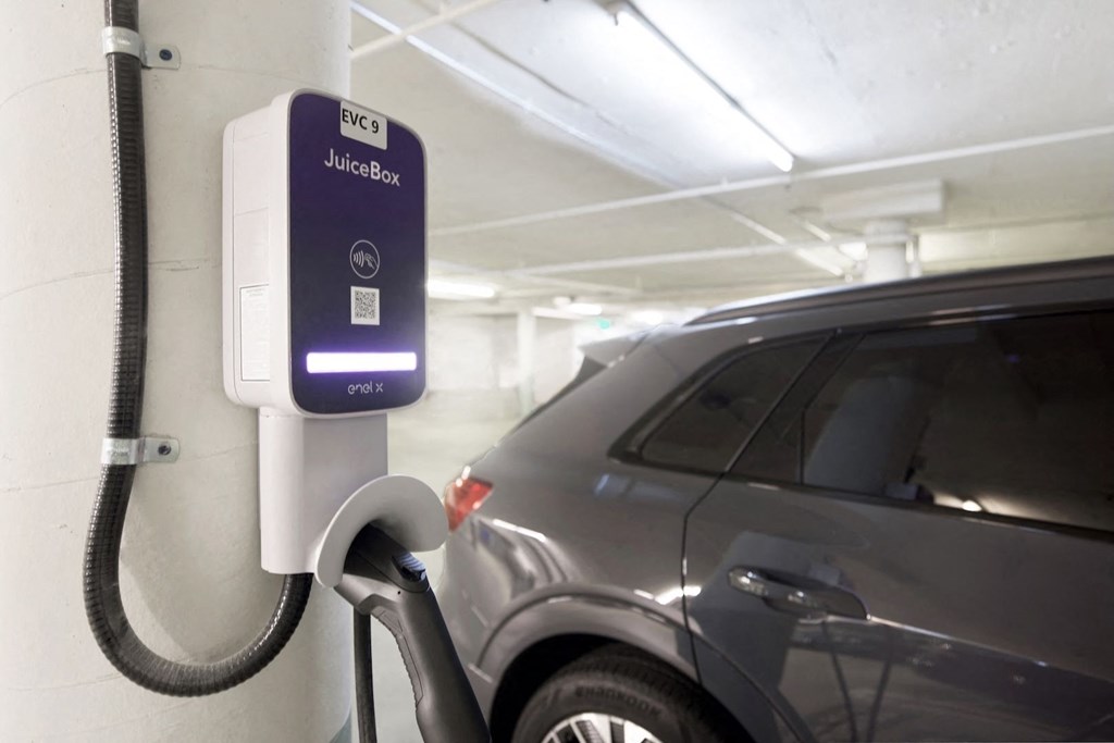 A car is being charged at charging station.