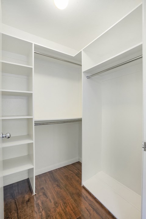 a bedroom with a closet and a sliding closet door