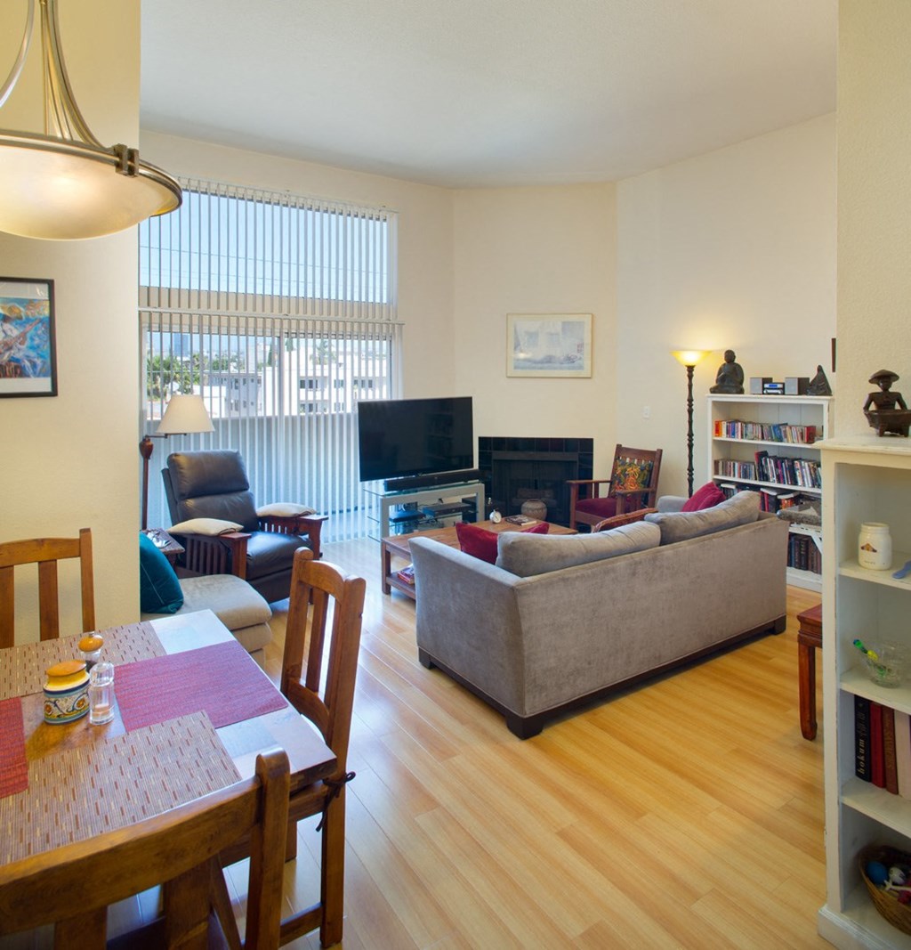 Apartment living room with private balcony, dining area
