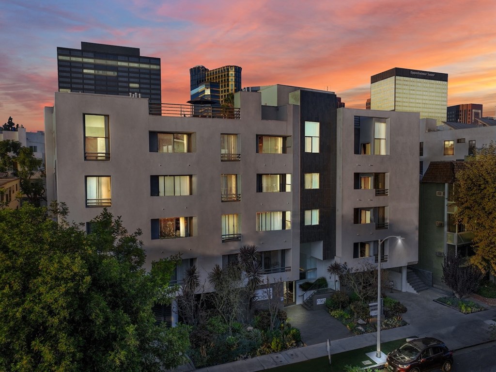 Exterior view of apartment building at dusk at Park Rochester, Los Angeles, CA, 90024.