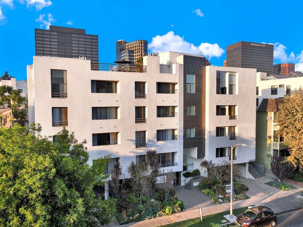 Exterior view of apartment building across the street at Park Rochester, Los Angeles, CA, 90024.