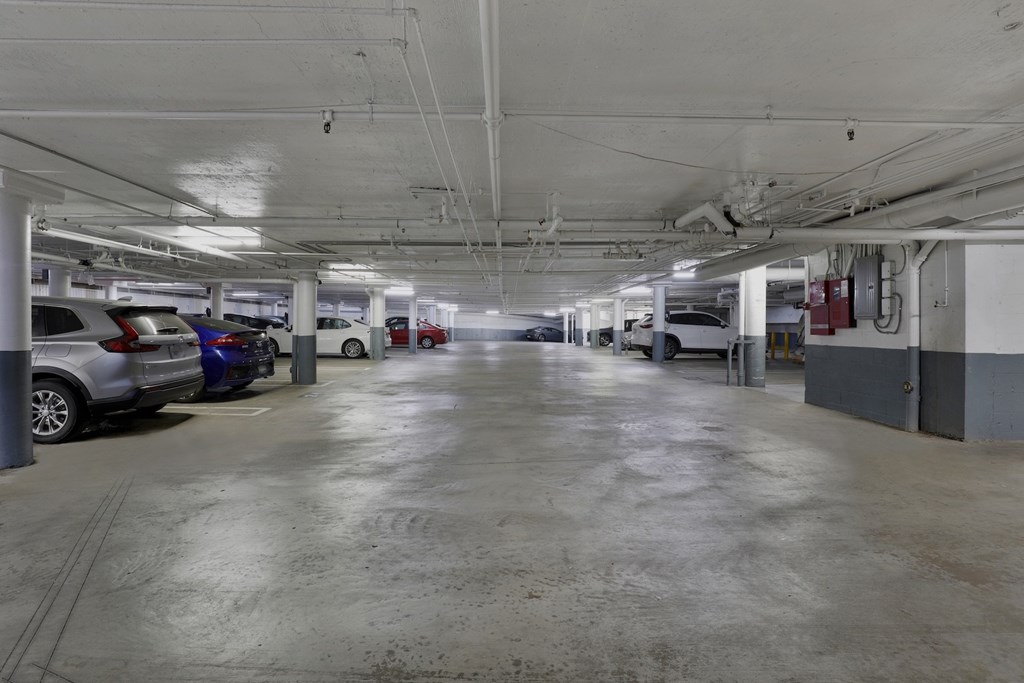 Parking Garage A spacious parking garage with multiple cars parked.