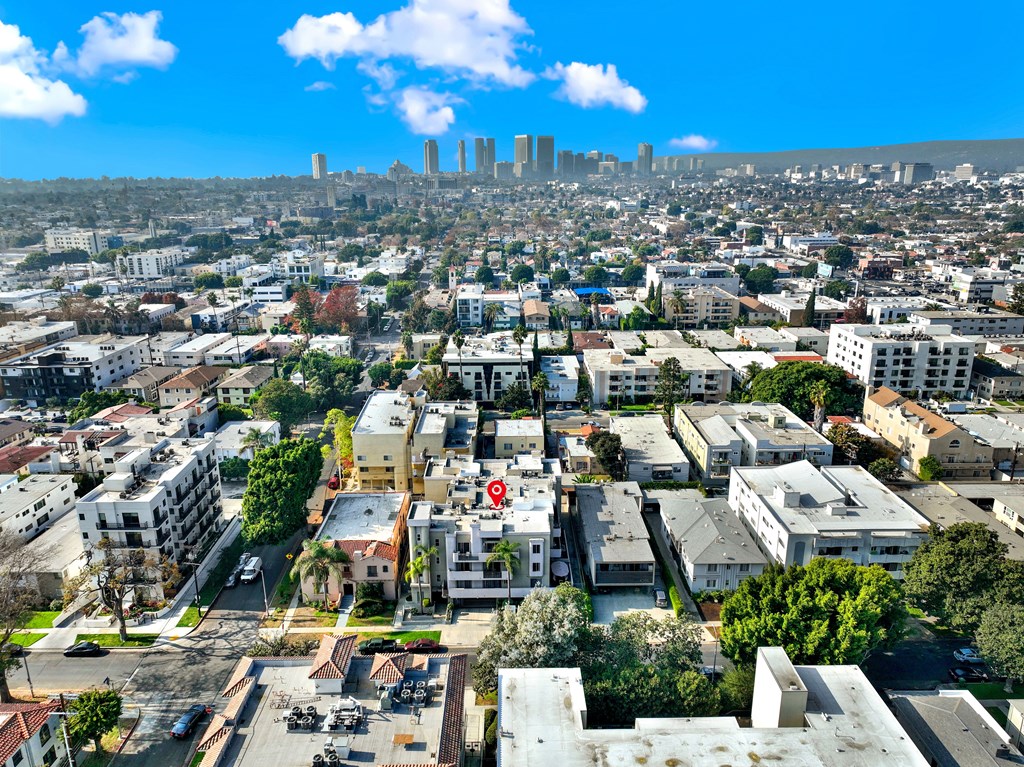 A cityscape with buildings and a clear sky.