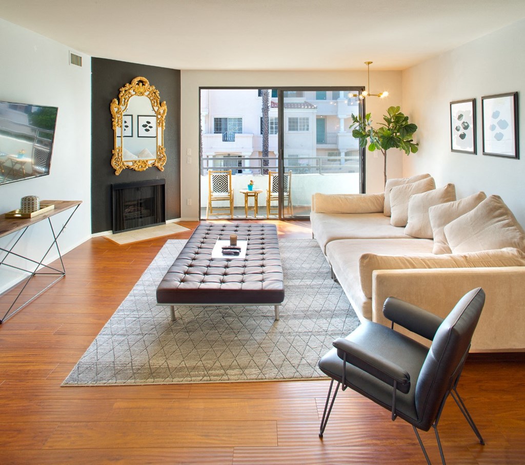 Apartment living room with fireplace and private balcony