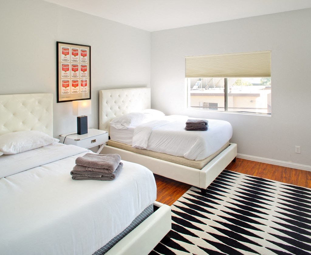Apartment bedroom with wood flooring